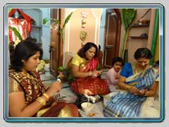 Family members busy with rituals during Durgapuja at Baghbazar Haldarbari